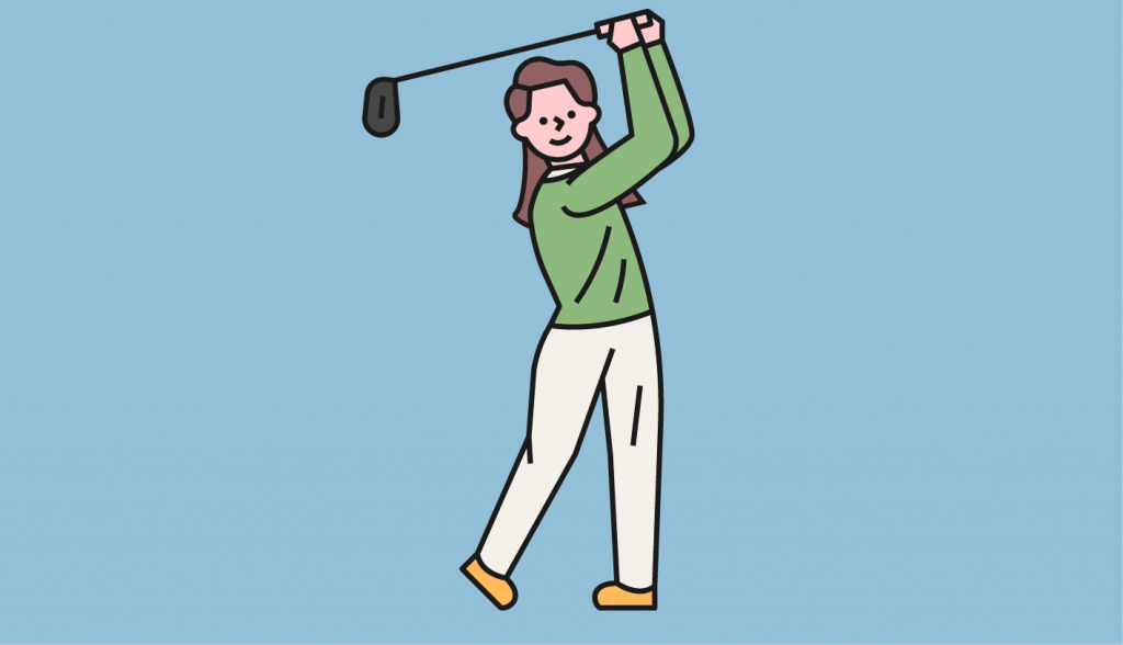 女性がゴルフをしている画像