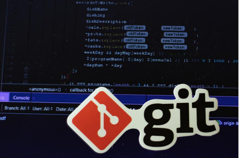 Git logo sign with program code background